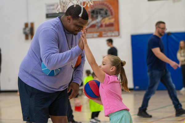 Coach and girl High Five